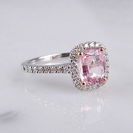 ring with diamonds and pink gemstone