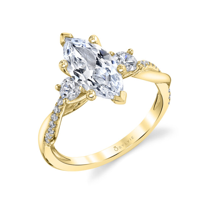 marquise shaped 3 stone engagement ring in yellow gold