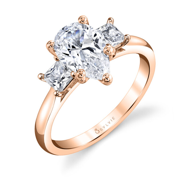 pear cut ring with princess cut side stones in rose gold