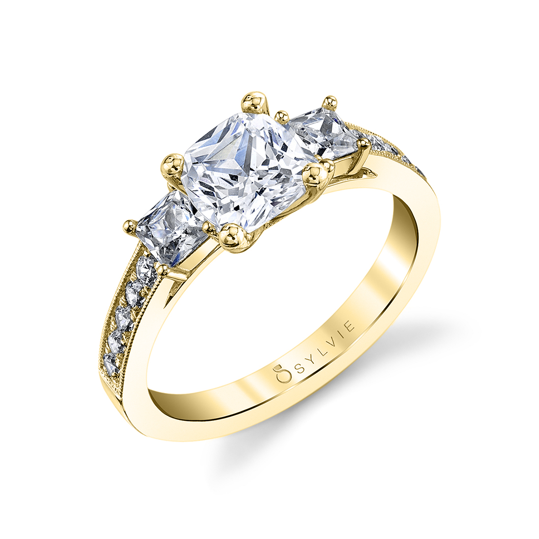classic 3 stone engagement ring in yellow gold