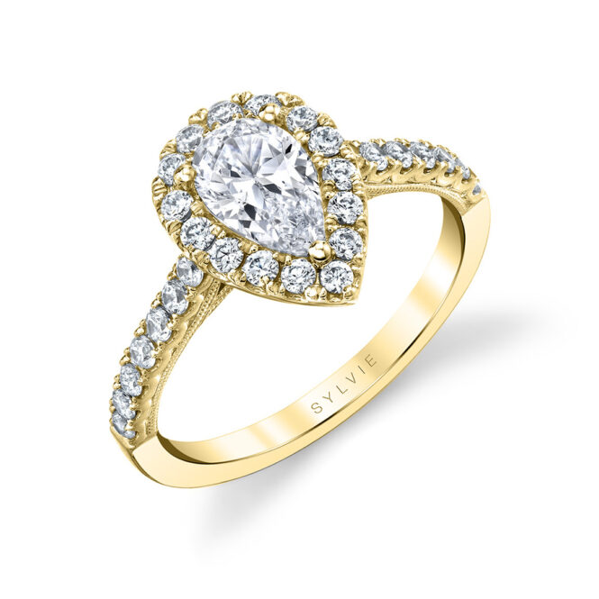 pear shaped halo engagement ring in yellow gold
