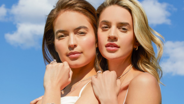 bride and bridesmaid posing with Sylvie fashion and wedding jewelry accessories