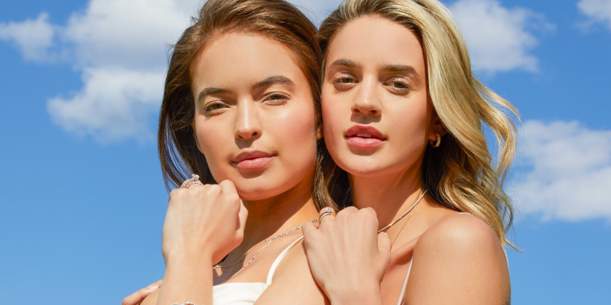 bride and bridesmaid posing with Sylvie fashion and wedding jewelry accessories