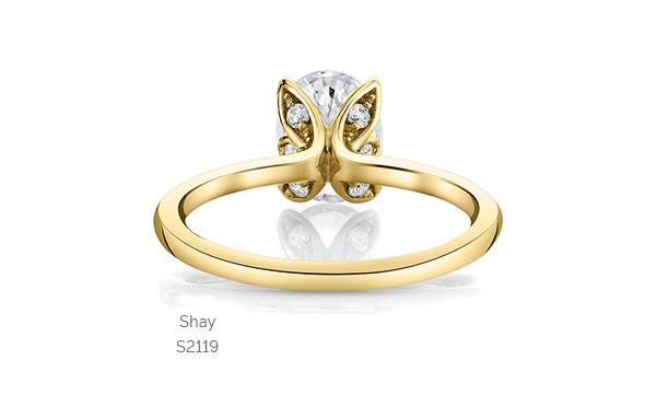 oval cut flower solitaire engagement ring in yellow gold