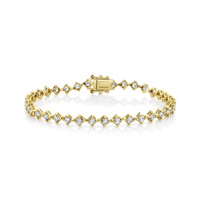 yellow gold four prong offset diamond bracelet