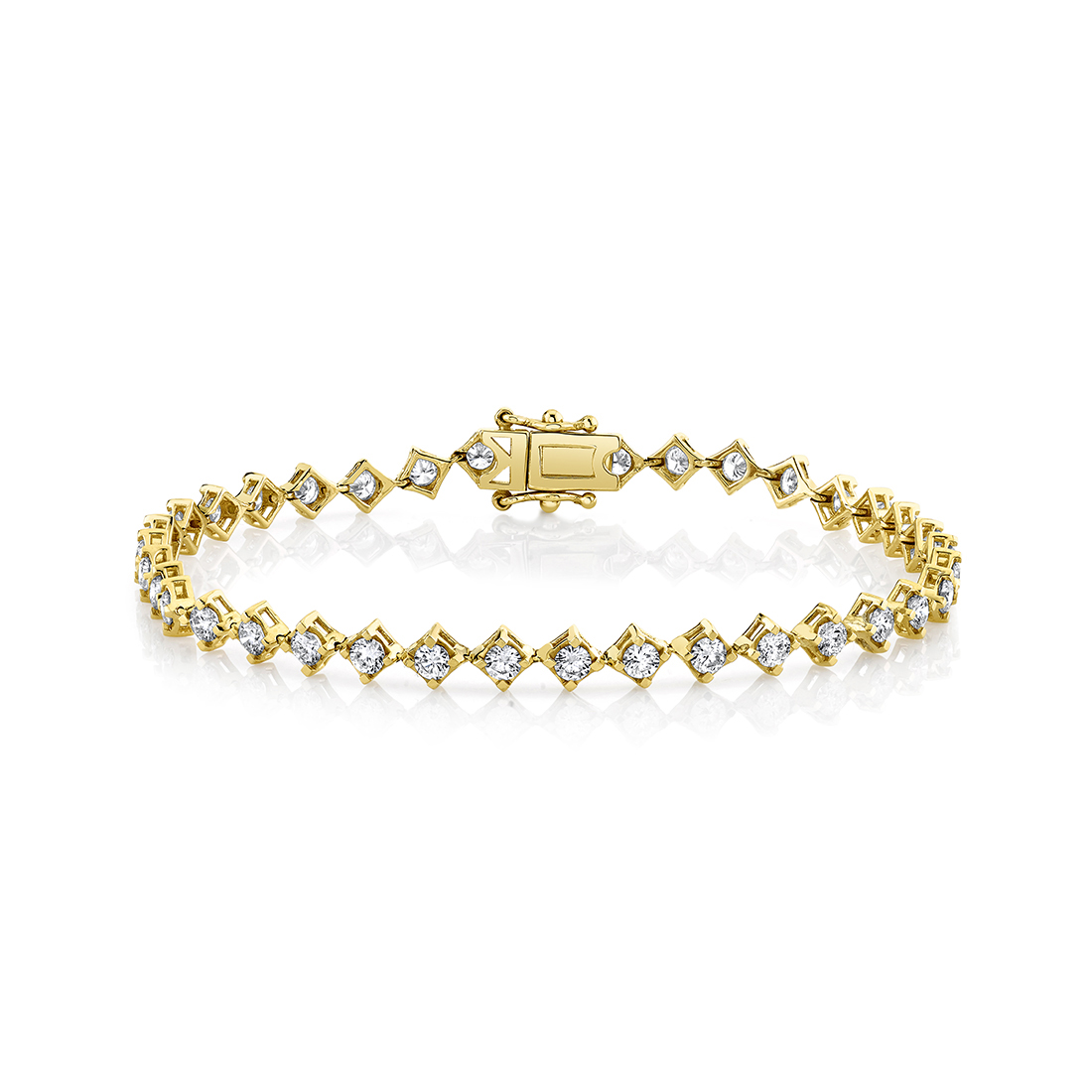 yellow gold four prong offset diamond bracelet