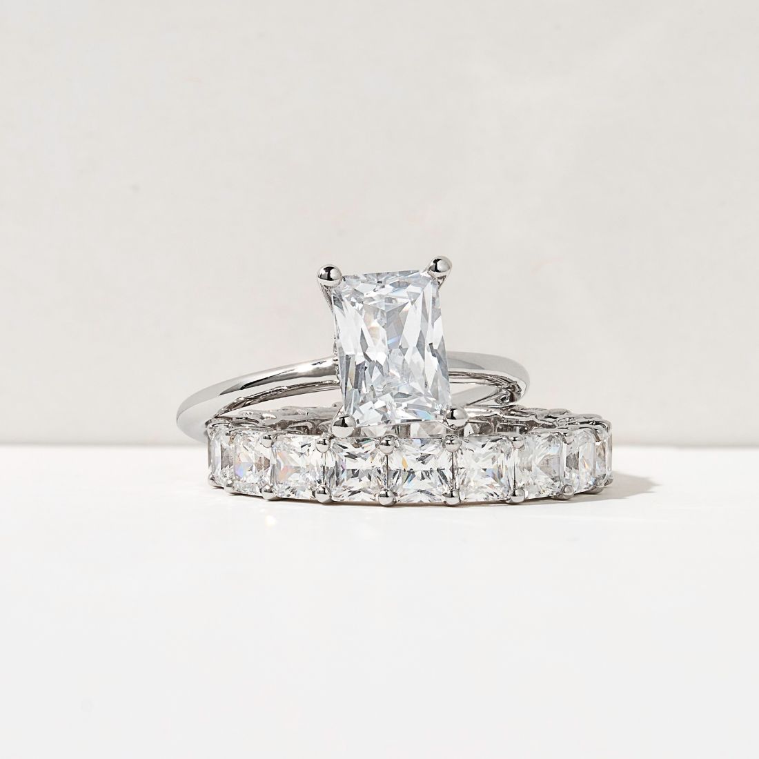 radiant cut solitaire engagement ring with an asscher eternity band