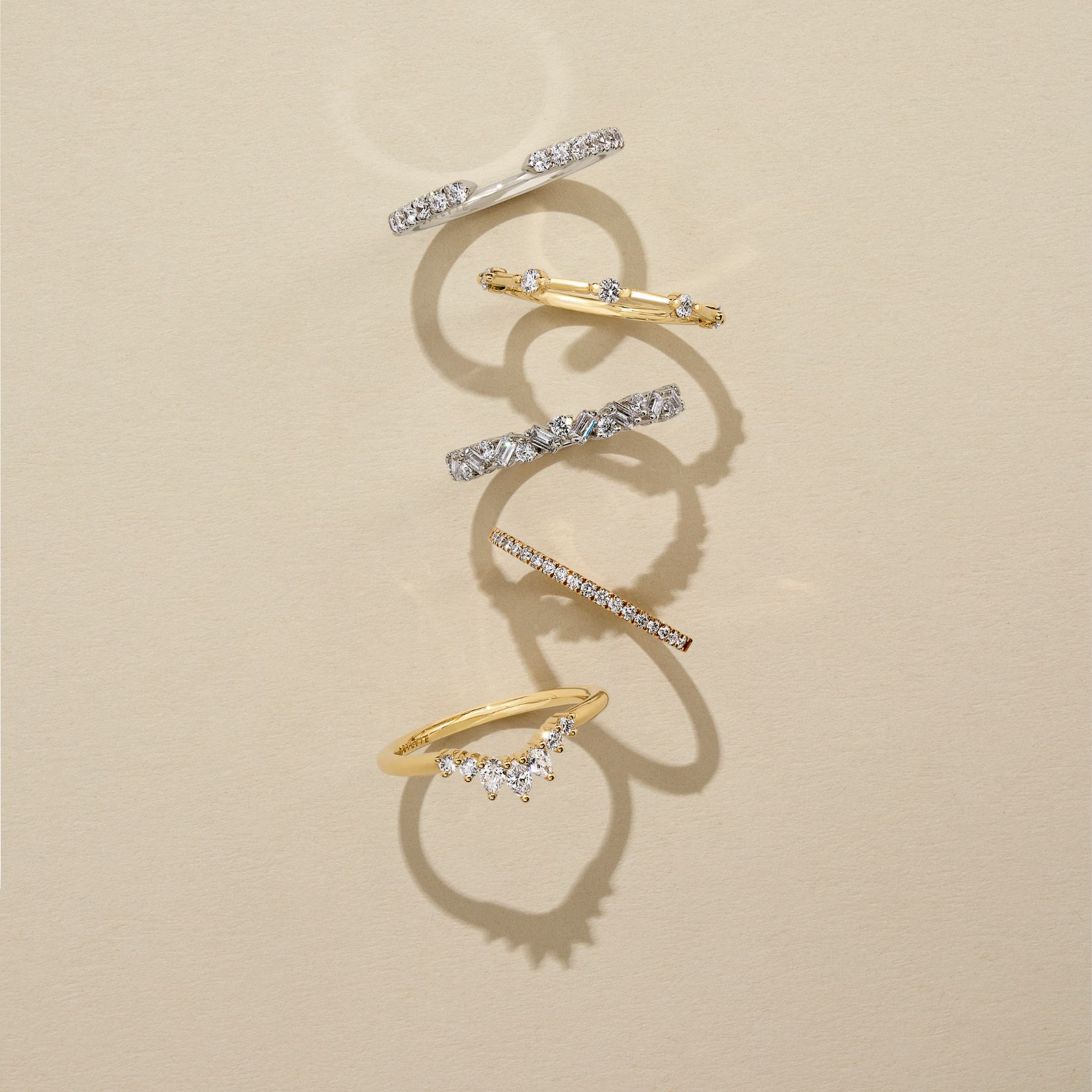 different types of wedding rings on a beige background