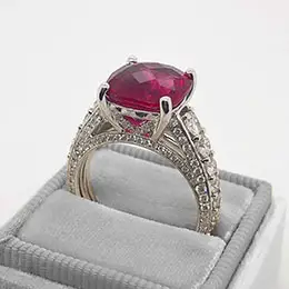 diamond and garnet ring in box