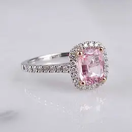 ring with diamonds and pink gemstone