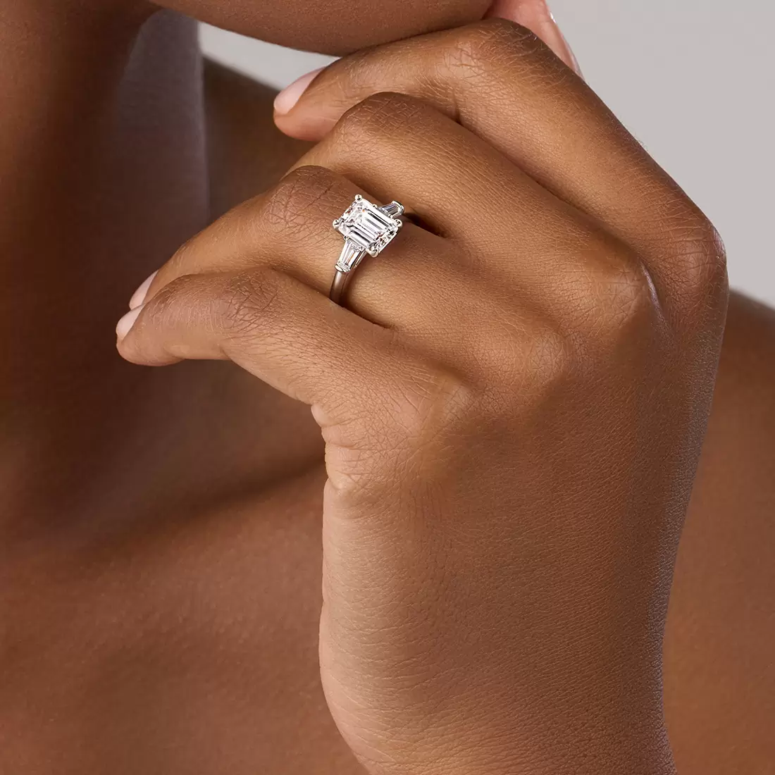 White Gold Emerald Cut Three Stone Engagement Ring with Baguettes - Nicolette - Lifestyle Image