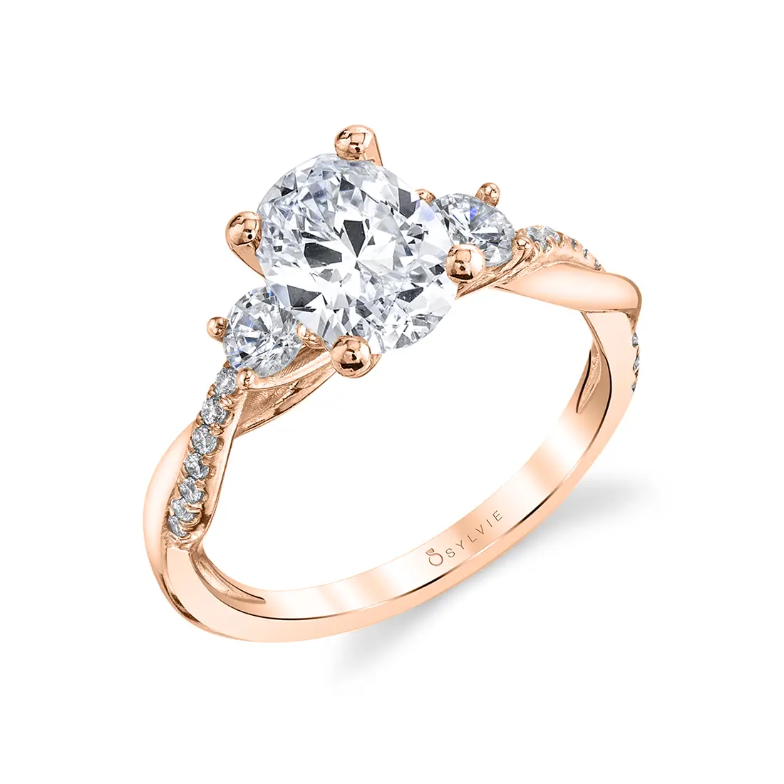 3 stone oval engagement ring with round side stones shown in rose gold - Style 