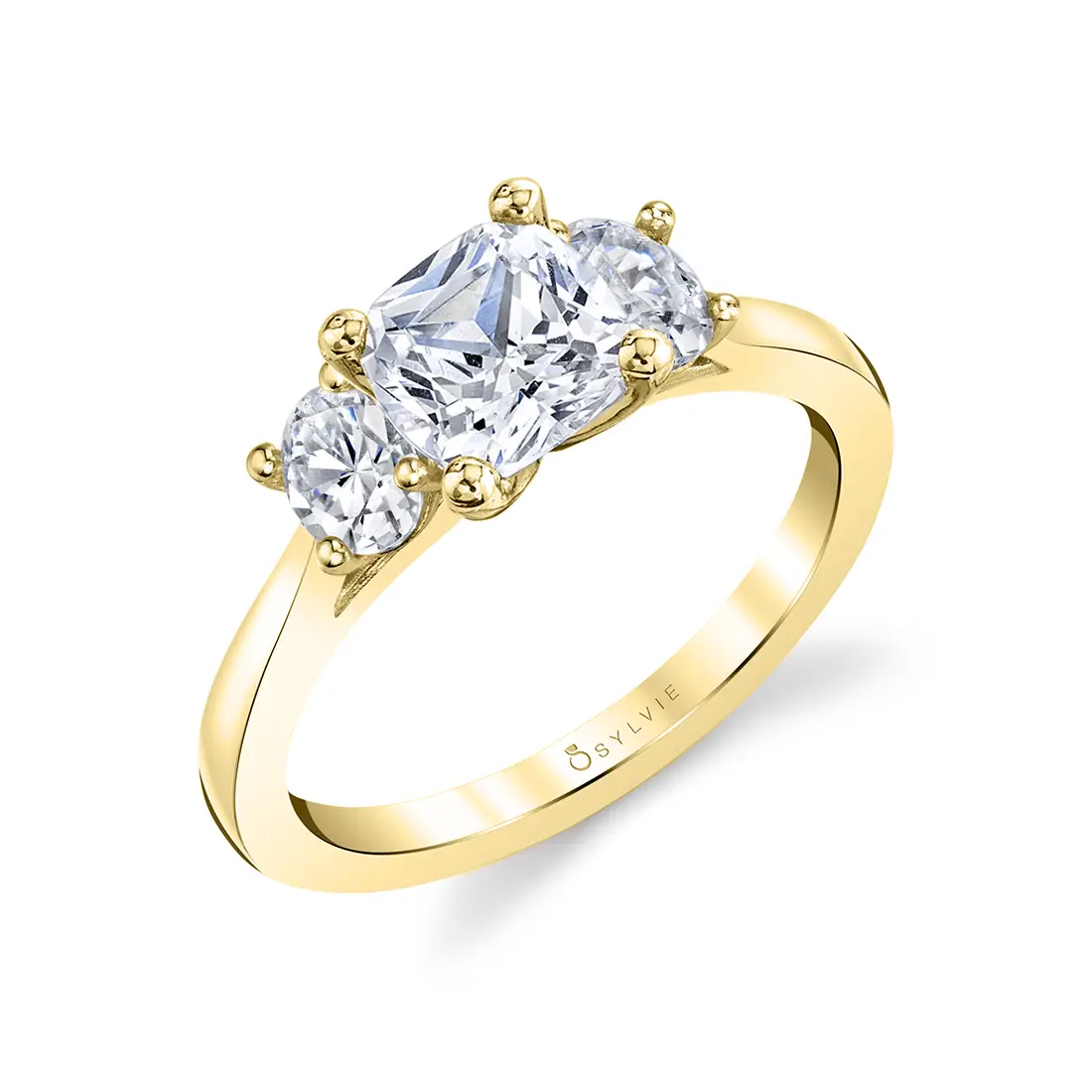 cushion cut 3 stone engagement ring in yellow gold