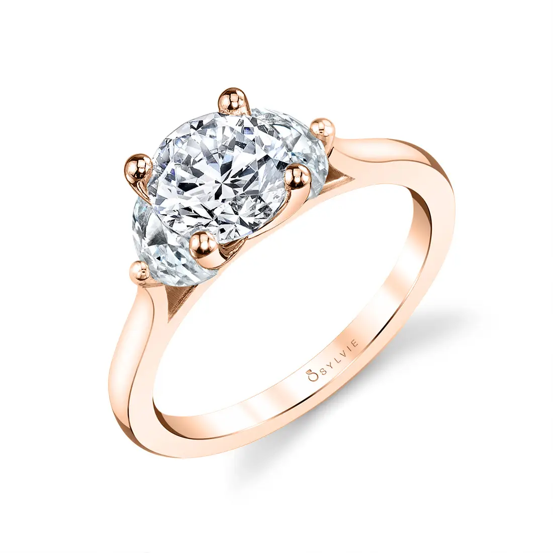 three stone engagement ring with half moon side stones in rose gold