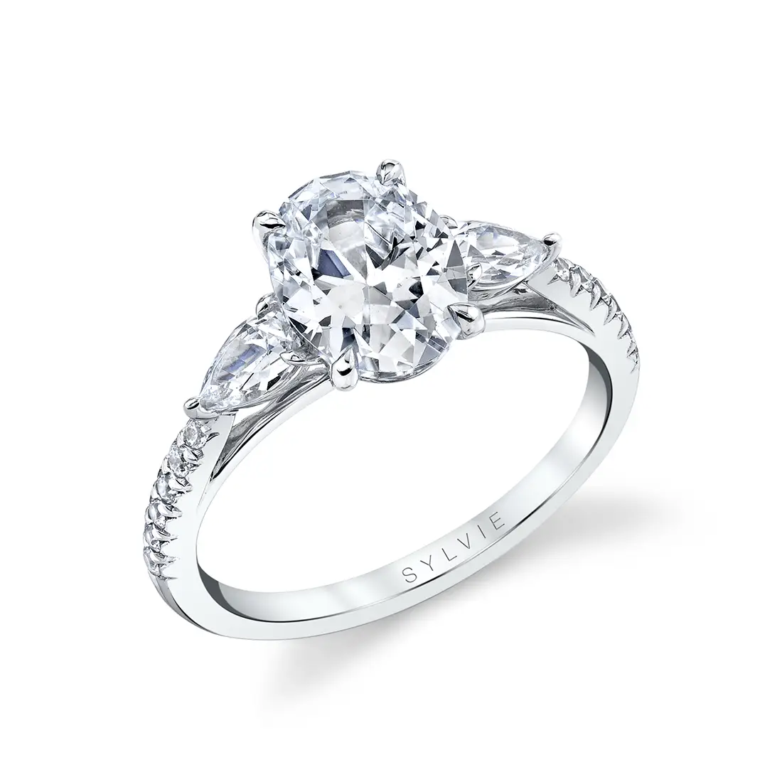 Three stone ring with pear shaped side diamonds shop