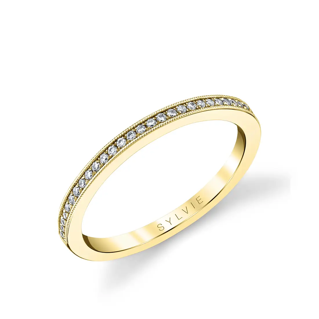 thin channel set wedding band in yellow gold