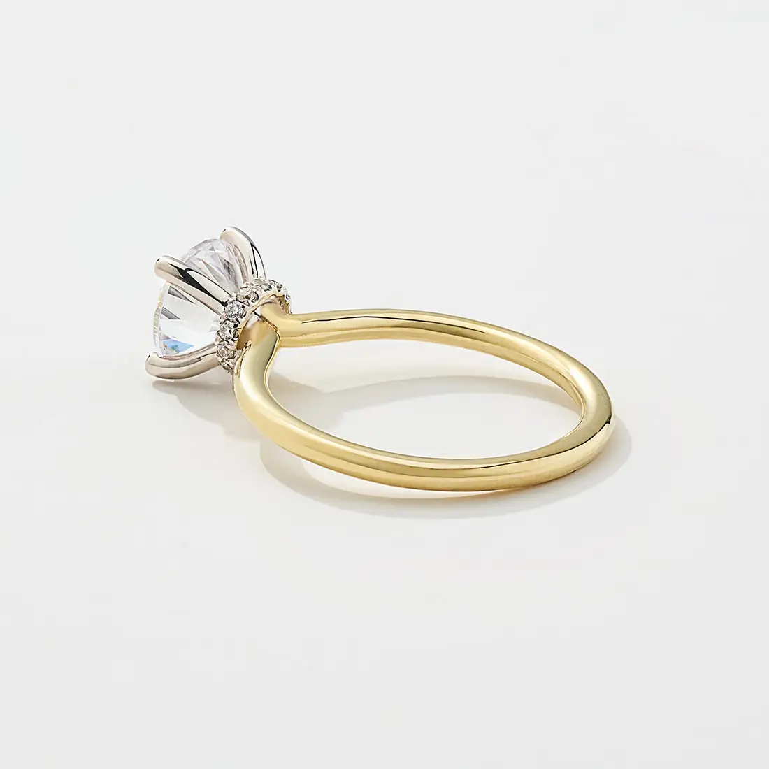 two tone solitaire halo engagement ring