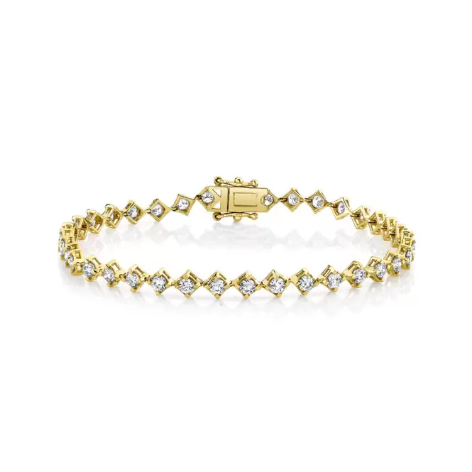 yellow gold four prong offset diamond bracelet