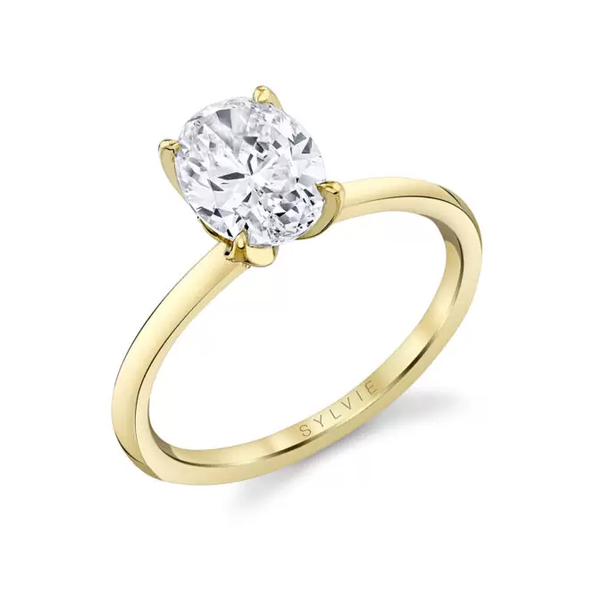 yellow gold oval cut floral inspired solitaire engagement ring