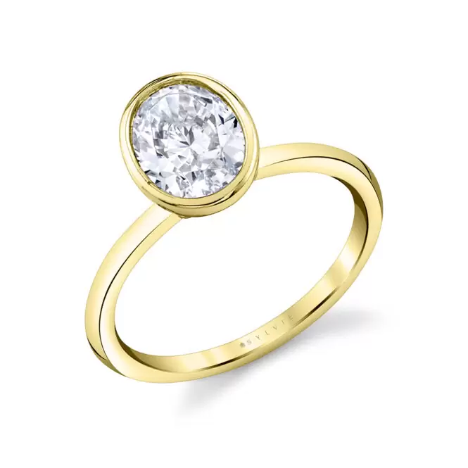 yellow gold oval cut bezel set engagement ring