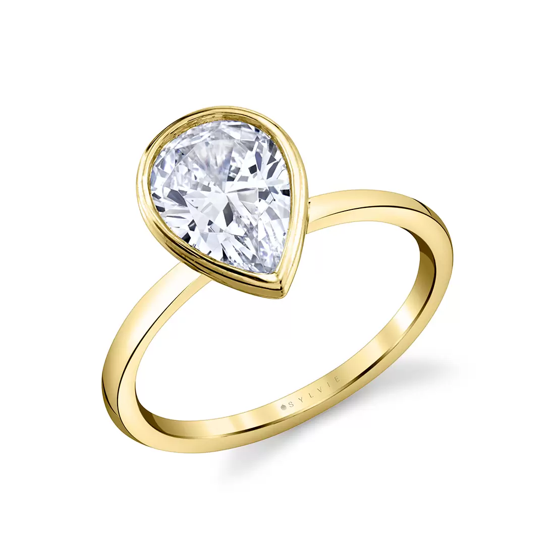 yellow gold pear shaped bezel set engagement ring