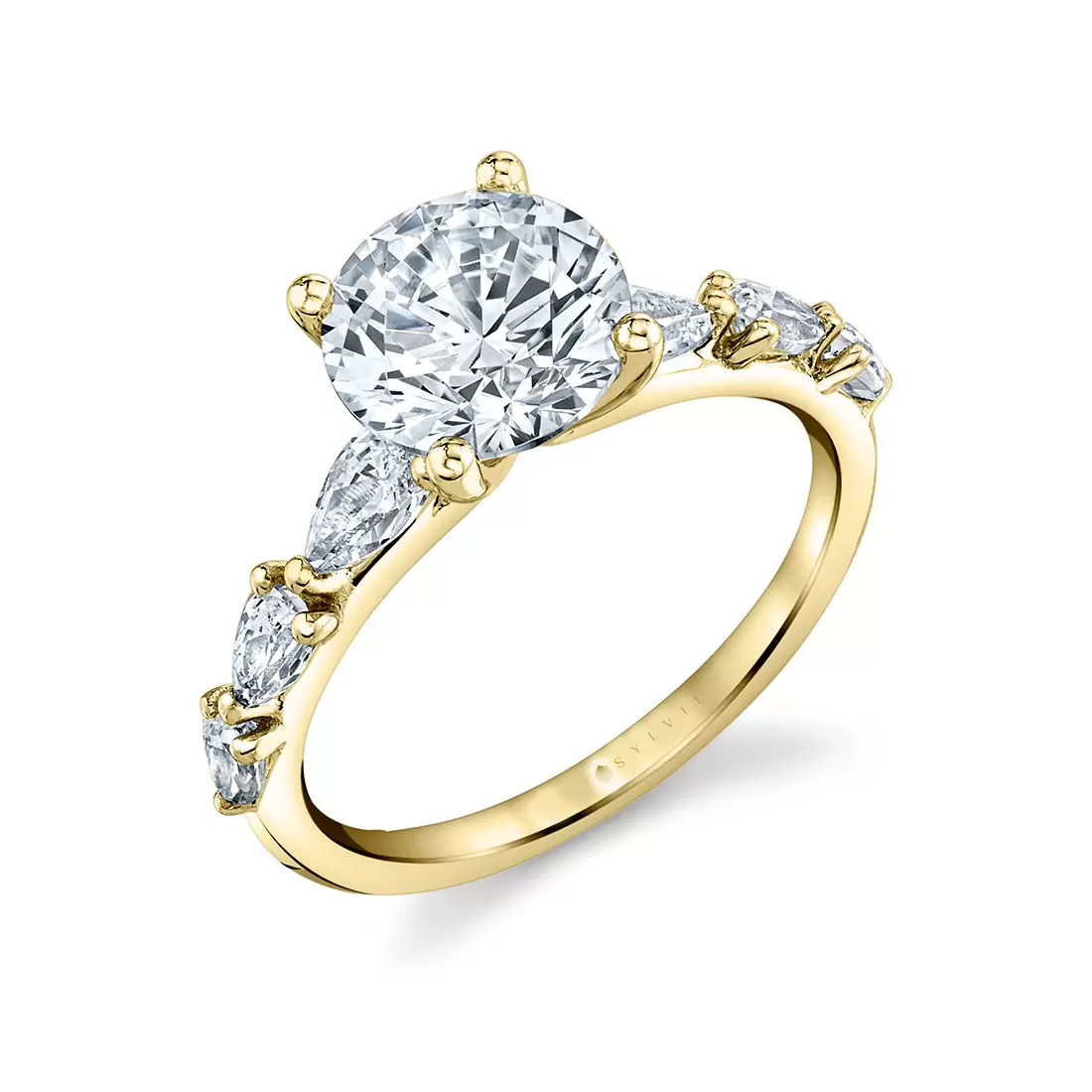 yellow gold round cut engagement ring with pear shaped side stones