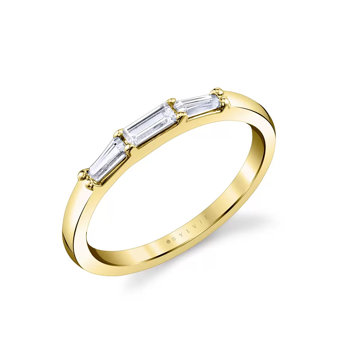 three stone prong set baguette wedding ring in yellow gold