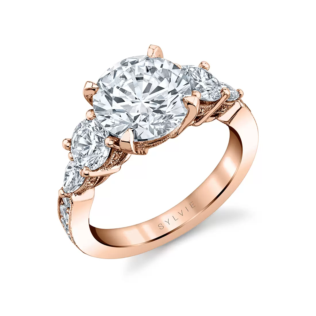 rose gold three stone engagement ring