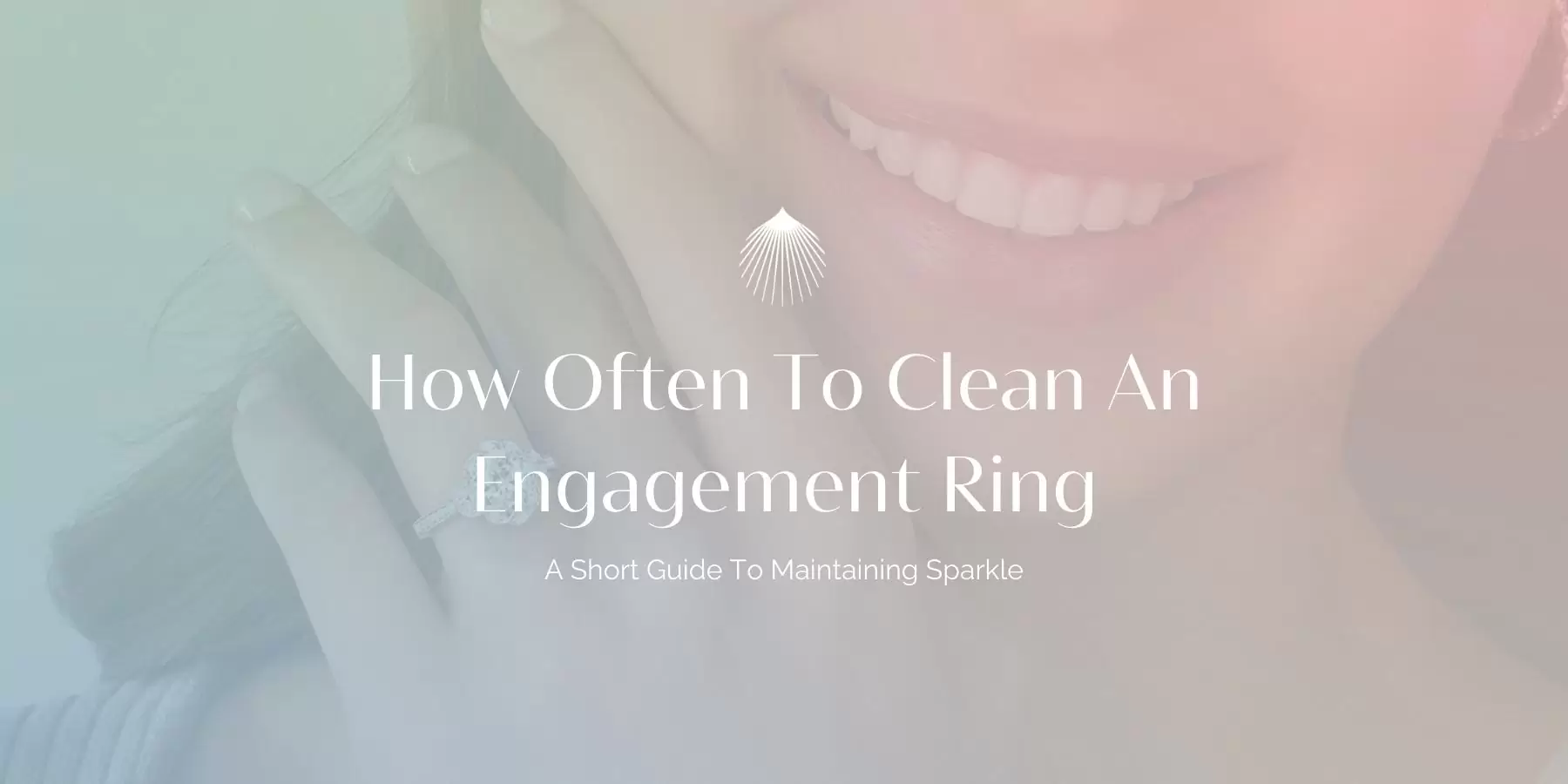 how often to clean an engagement blog header image with woman smiling and wearing a modern vintage floral engagement ring