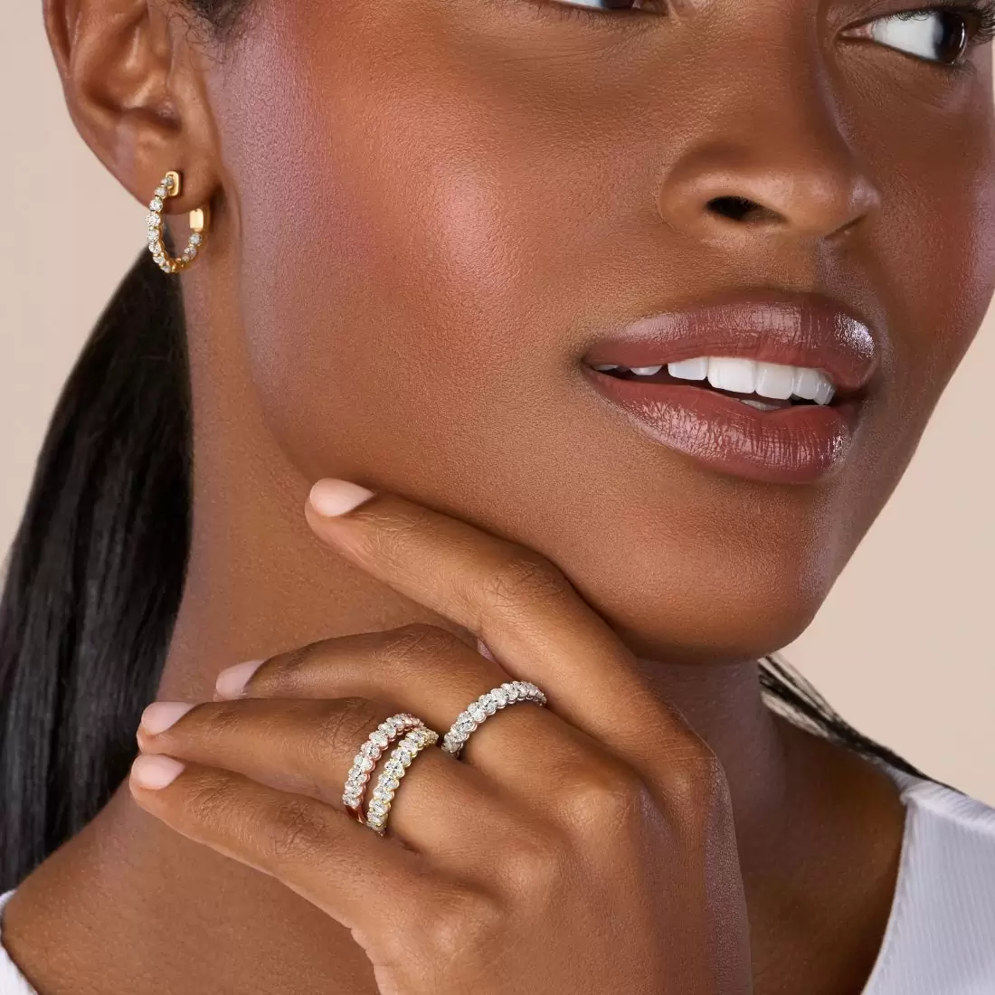 woman wearing three eternity rings